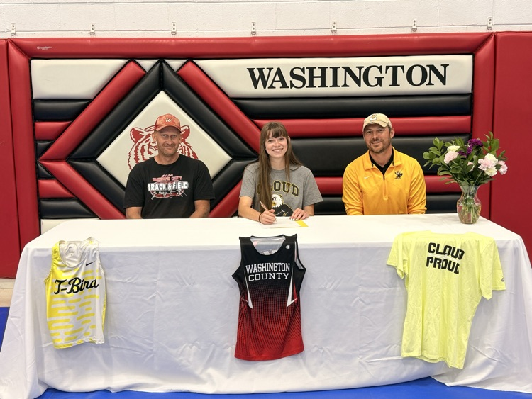 Alyssa Jueneman signing her letter of intent to run Track & Field with Cloud County Community College