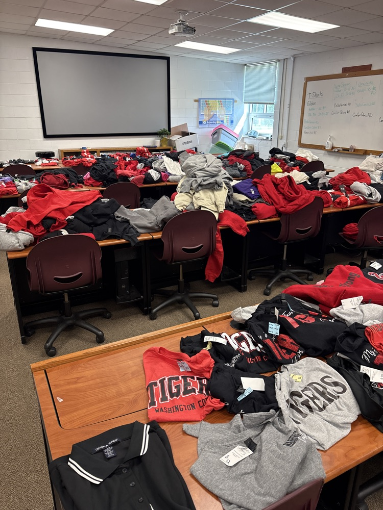 variety of colors and sizes of shirts