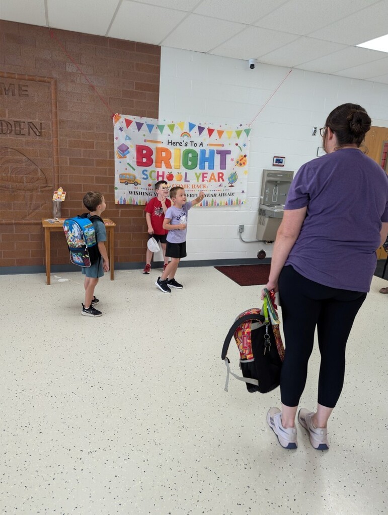 Back to school open house with parents, teachers, and students visiting classrooms.