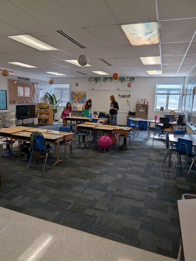 Back to school open house with parents, teachers, and students visiting classrooms.