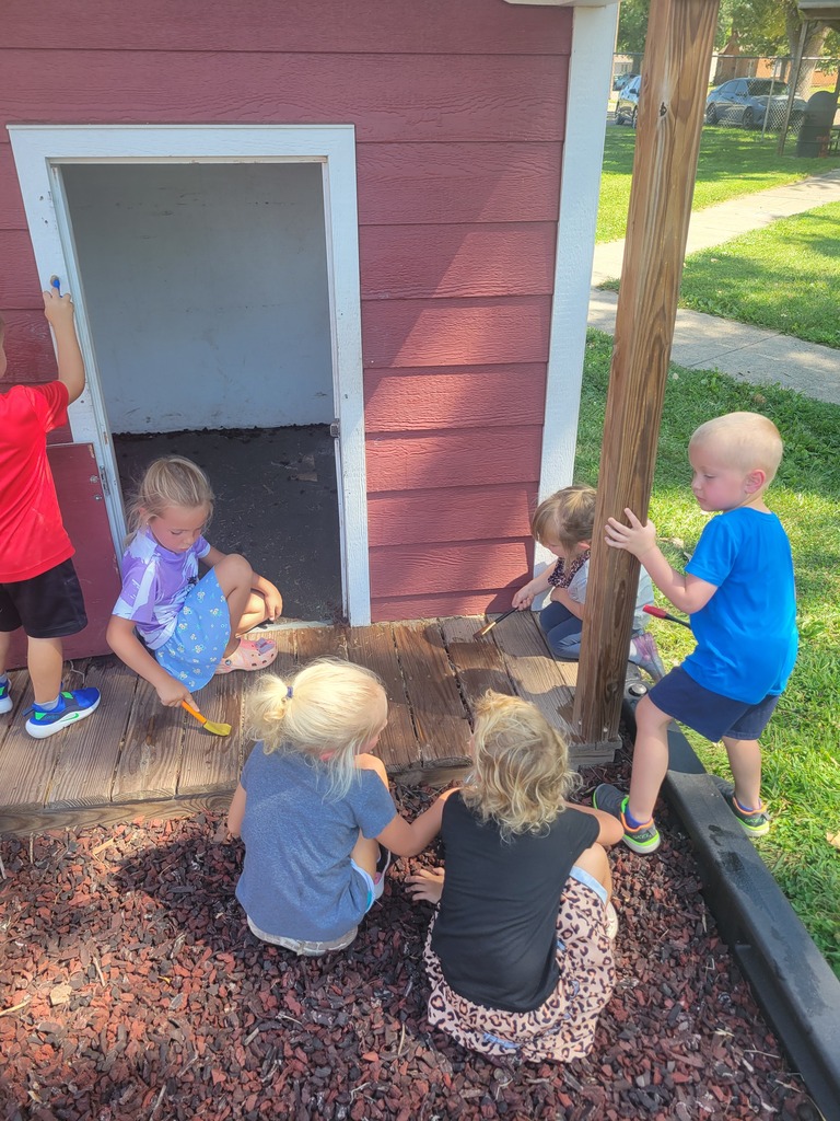 PM kids painting playhouse