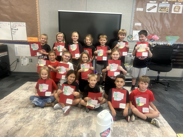 students with their U.S. symbols folder