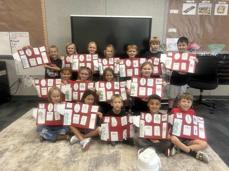 students with their U.S. symbols folder