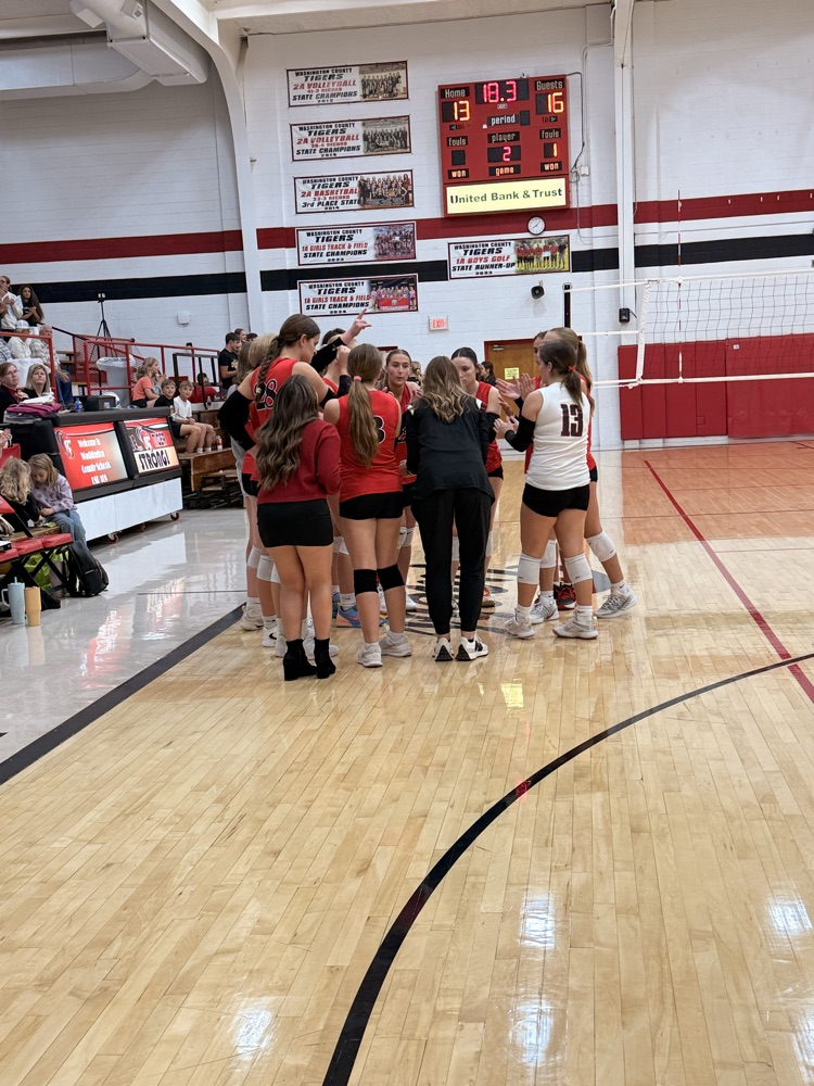 Tiger volleyball huddled up in a time-out 
