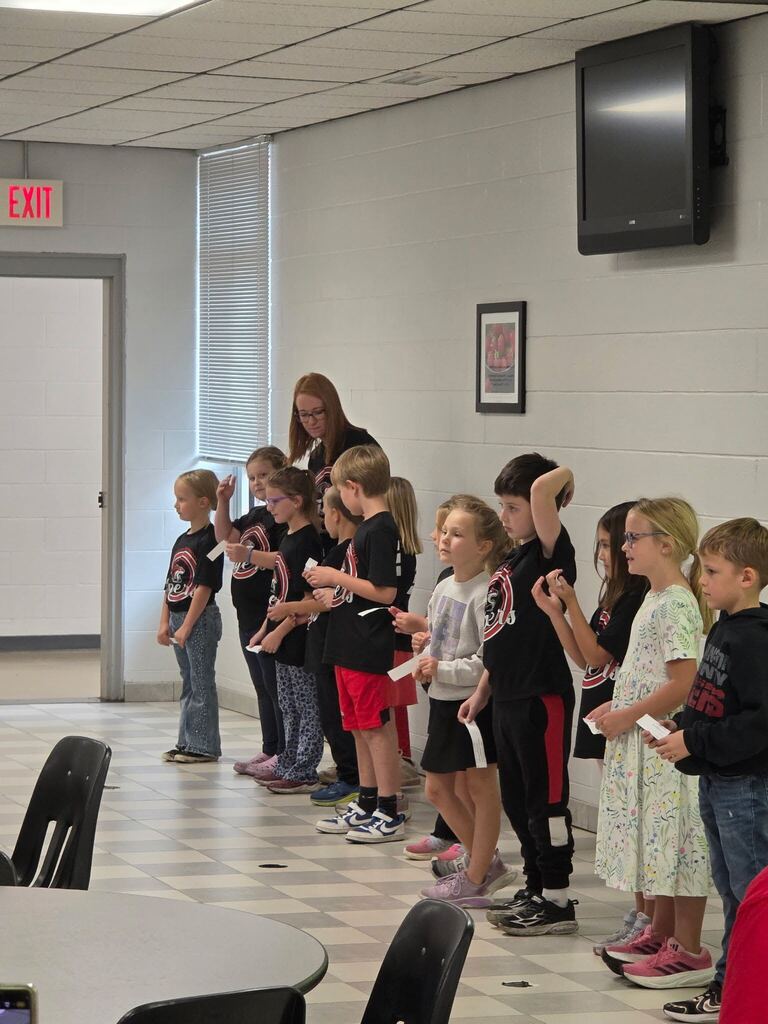 students performing for grandparents