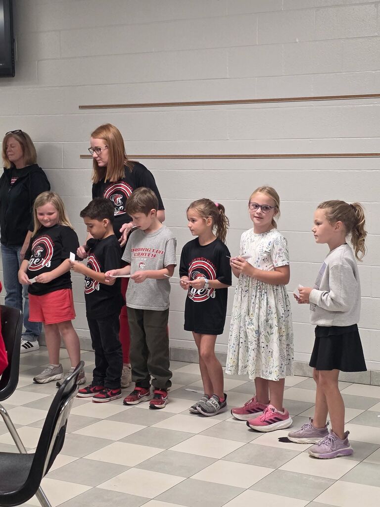 students performing for grandparents