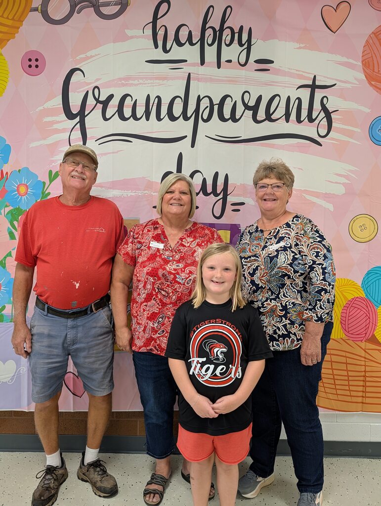 students posing with grandparents