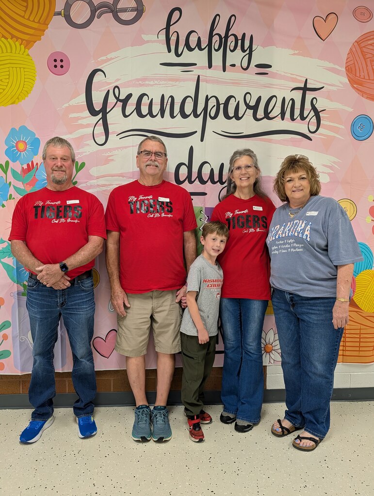 students posing with grandparents