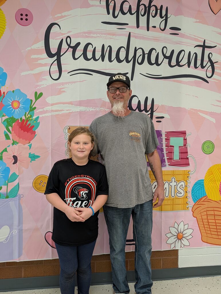 students posing with grandparents