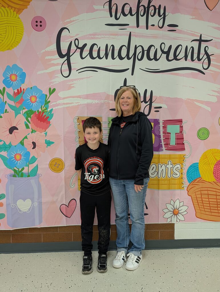 students posing with grandparents