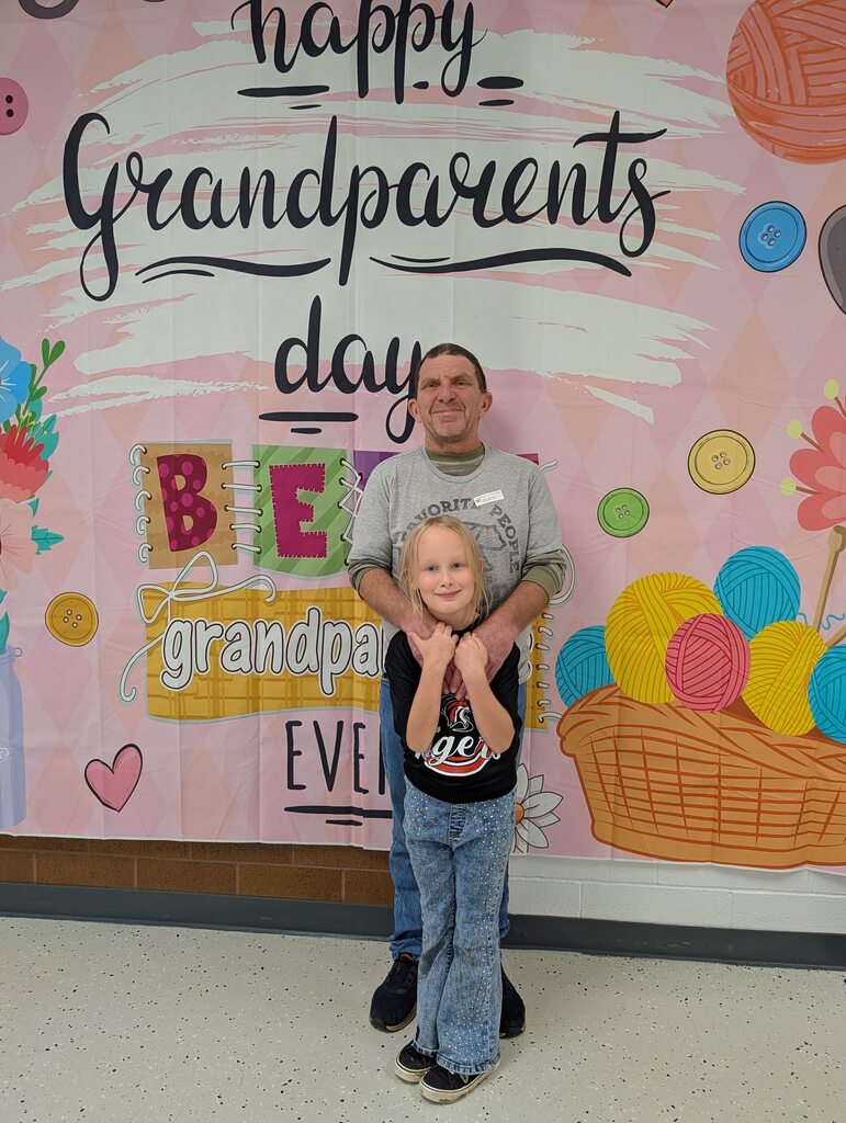 students posing with grandparents