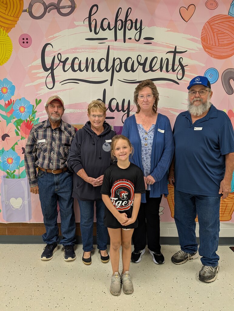 students posing with grandparents
