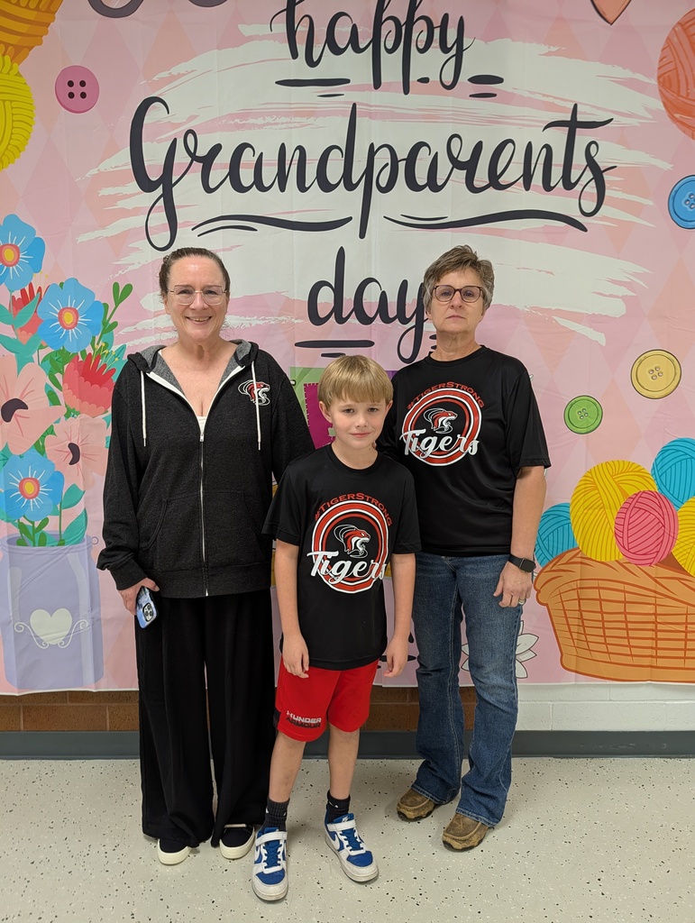 students posing with grandparents