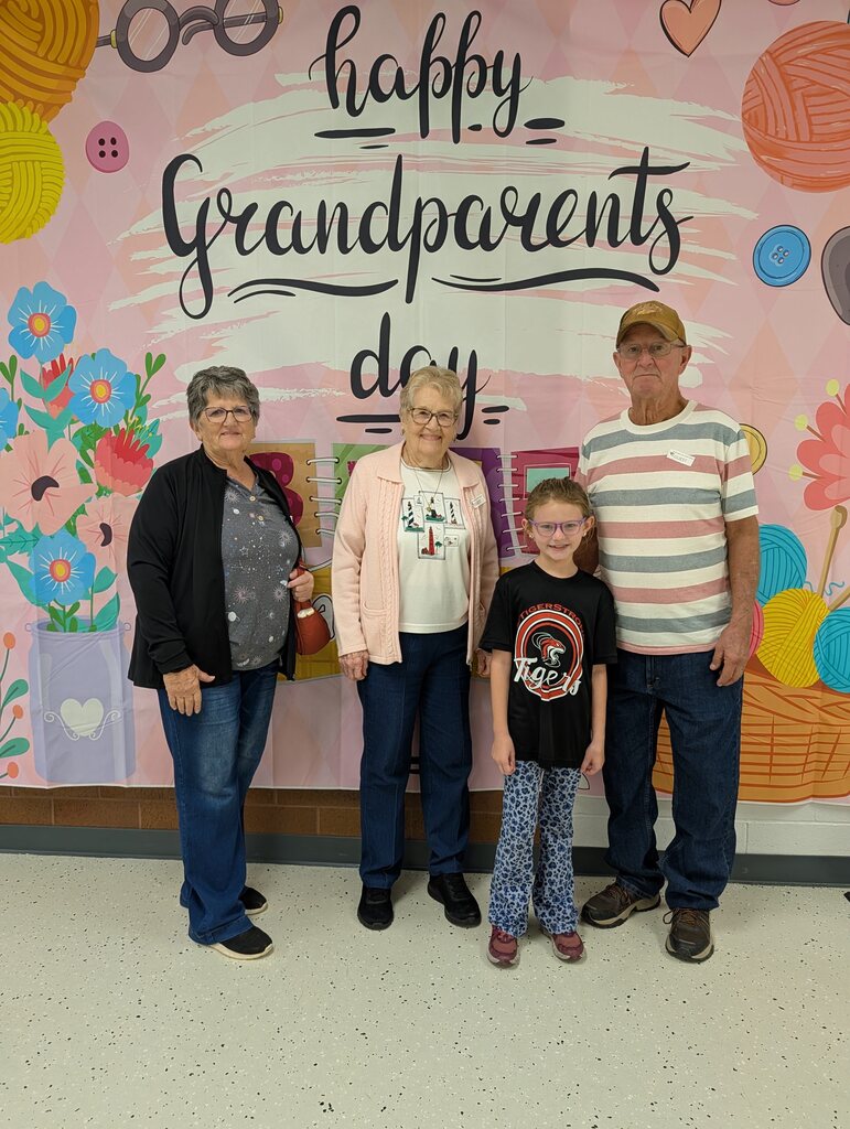 students posing with grandparents