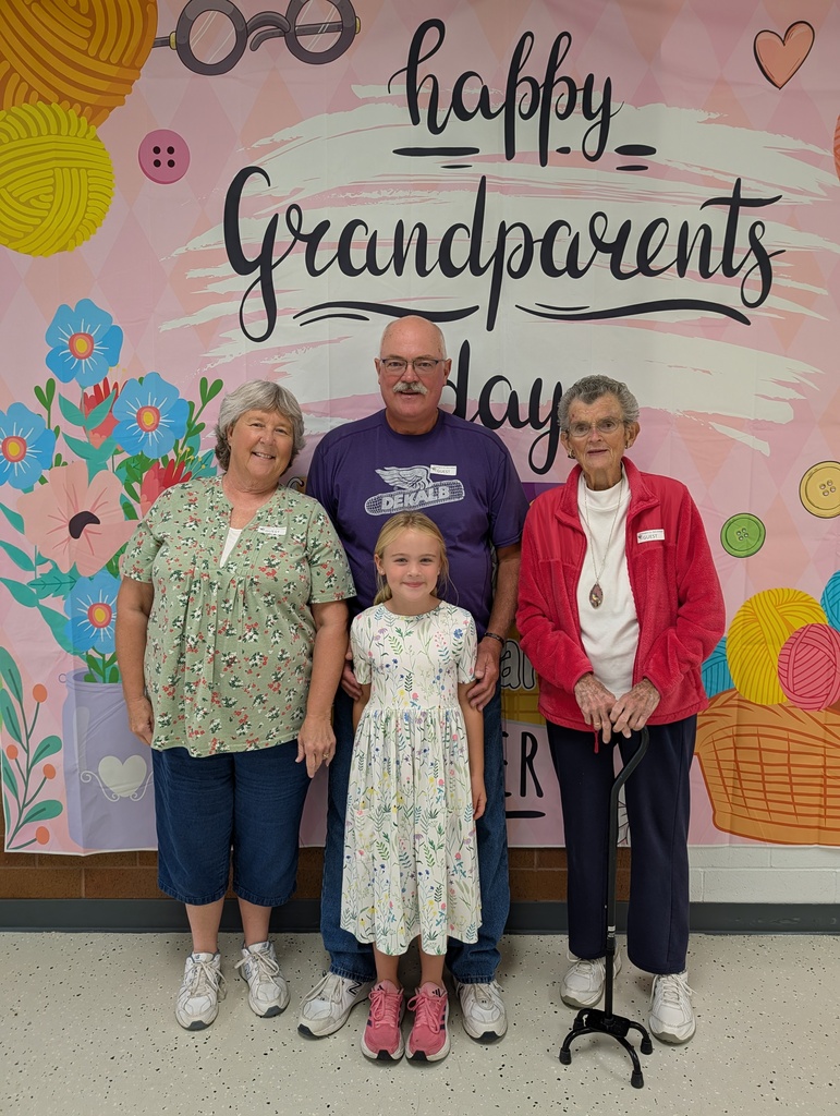 students posing with grandparents