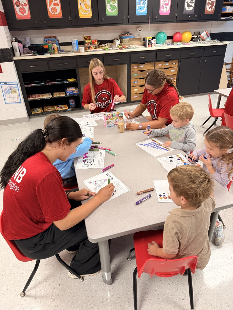 Homecoming candidates coloring with our 3 year old preschoolers