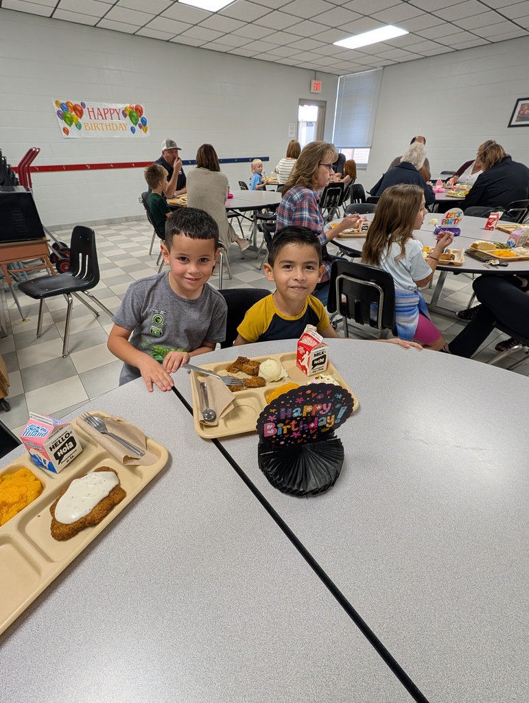 student with October birthday and family/friends eating lunch