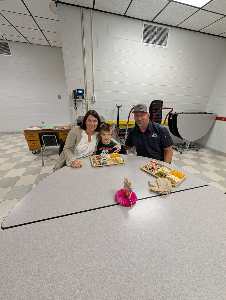 student with October birthday and family/friends eating lunch