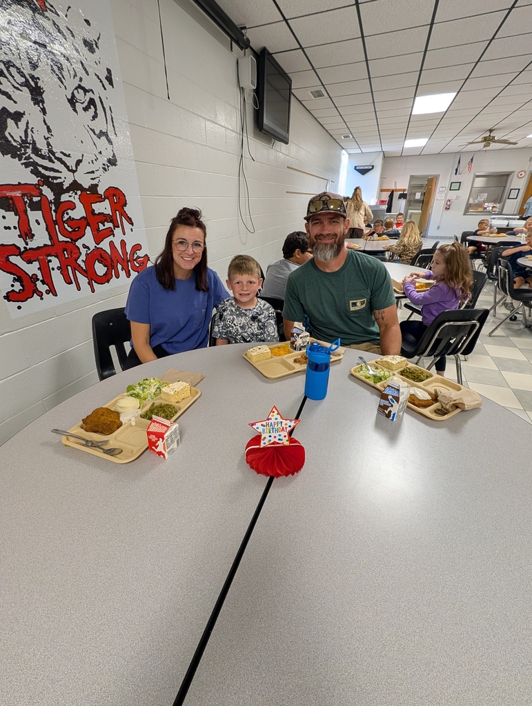 student with October birthday and family/friends eating lunch