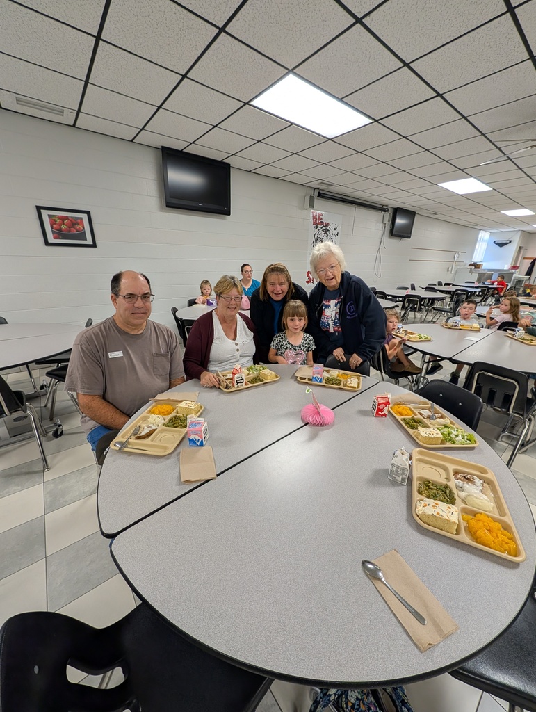 student with October birthday and family/friends eating lunch