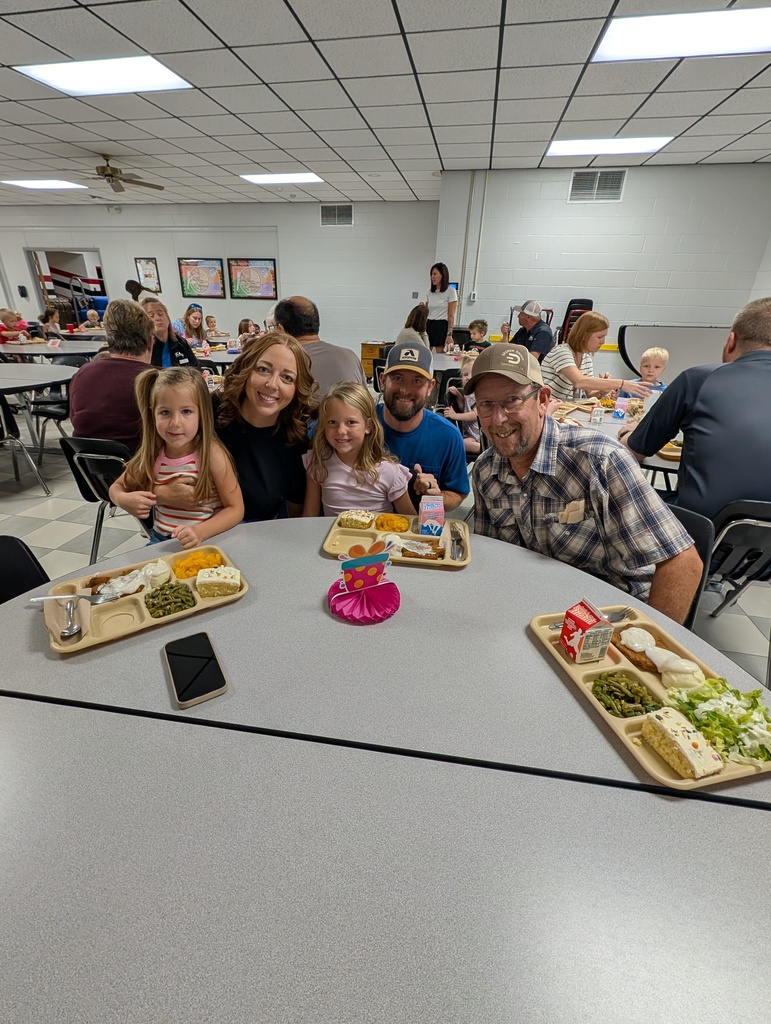 student with October birthday and family/friends eating lunch