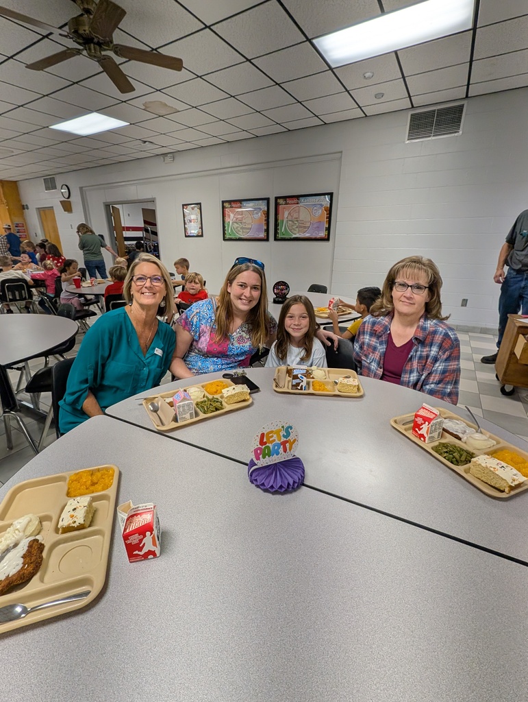 student with October birthday and family/friends eating lunch