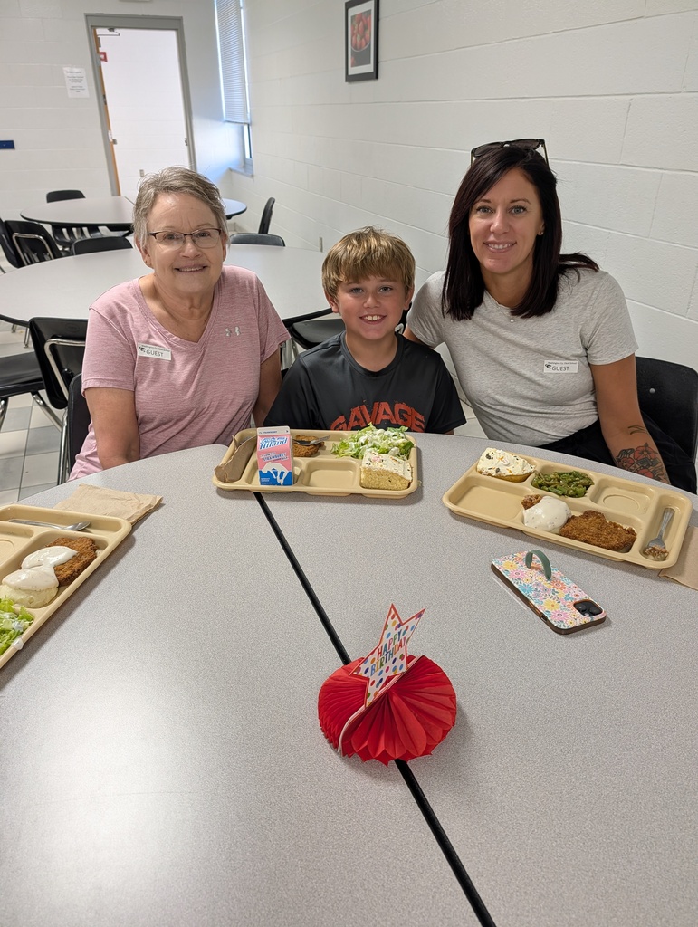student with October birthday and family/friends eating lunch