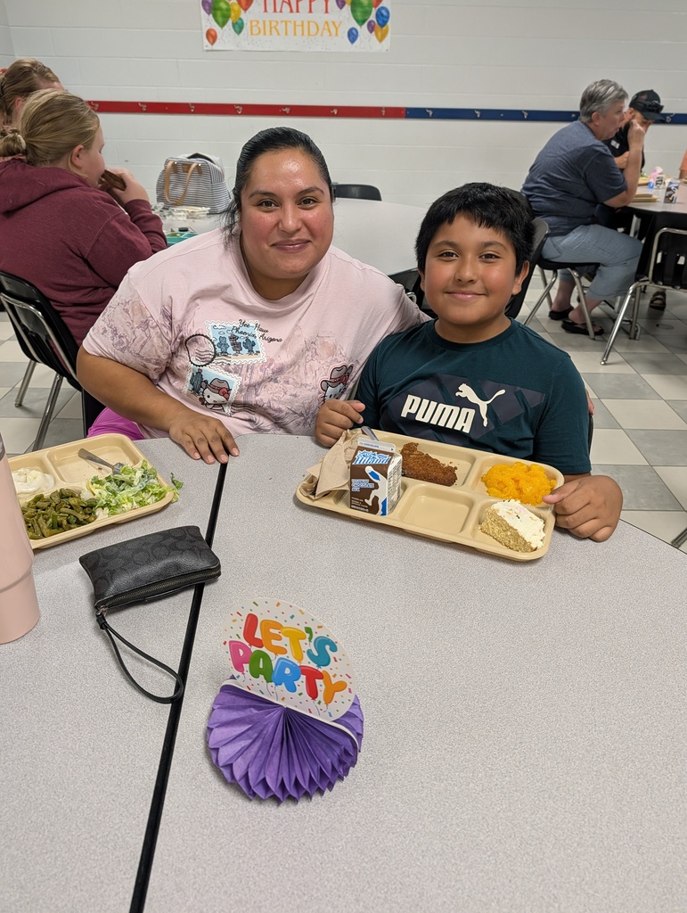 student with October birthday and family/friends eating lunch