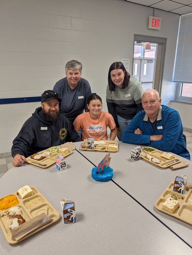 student with October birthday and family/friends eating lunch