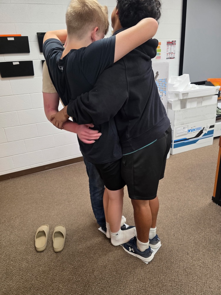 boys working together to survive in class