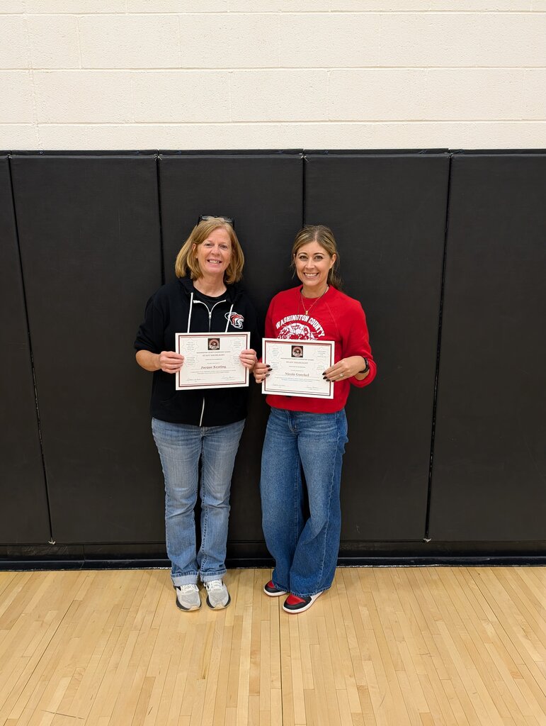 Mrs. Keating and Mrs. Goeckel holding their certificates for 1st nine weeks staff highlight