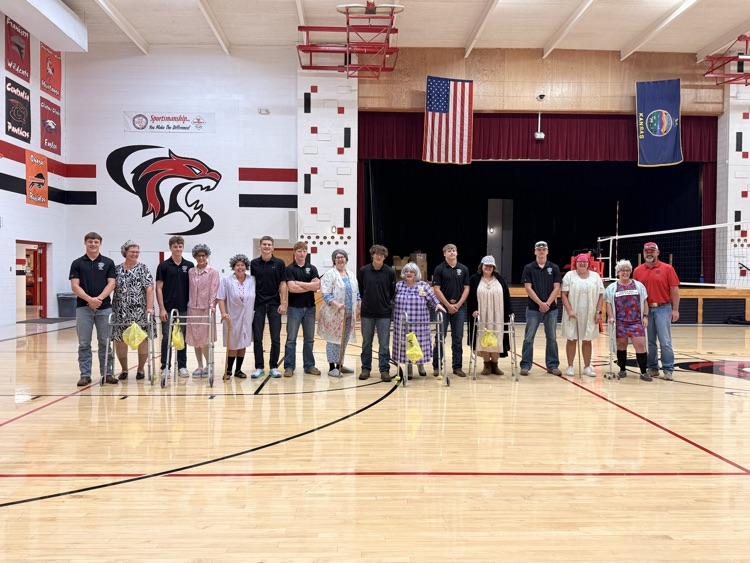 Senior Football boys and their moms along with Coach Hatesohl and his wife  