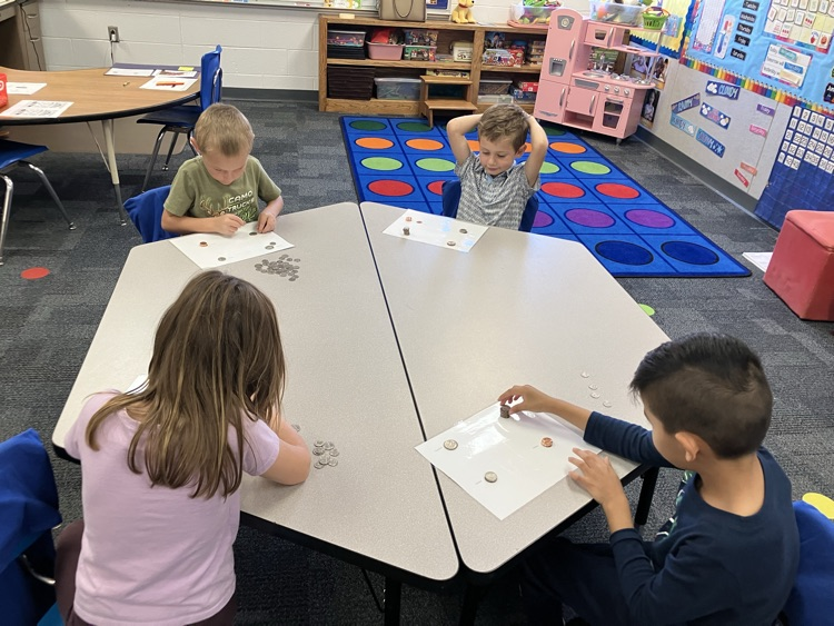 Kindergarten students sorting coins