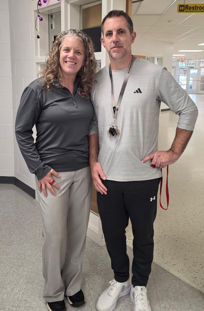 Mr. Sanneman & Ms. Busch in their matching grey outfits