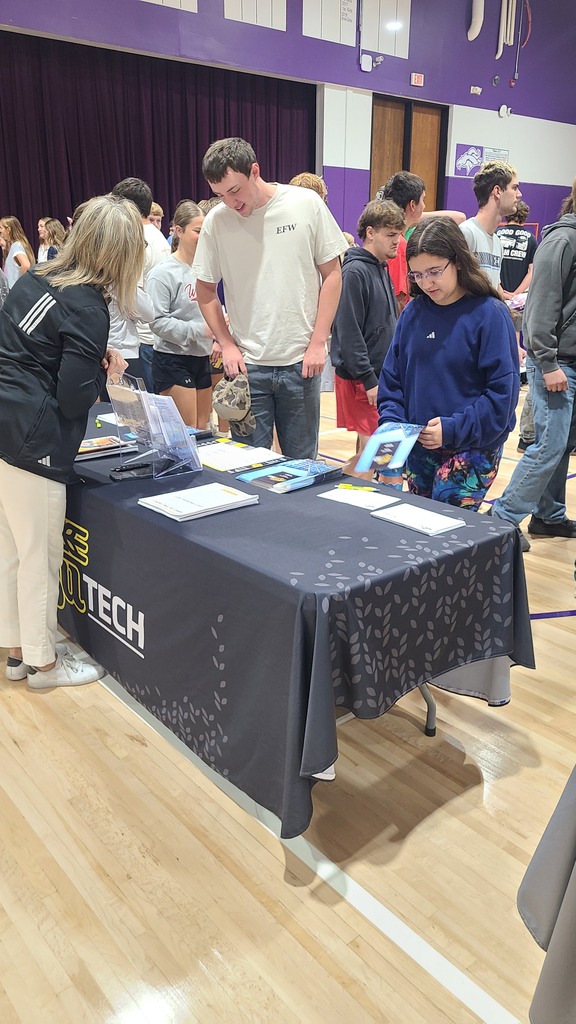Students engaging with representatives.