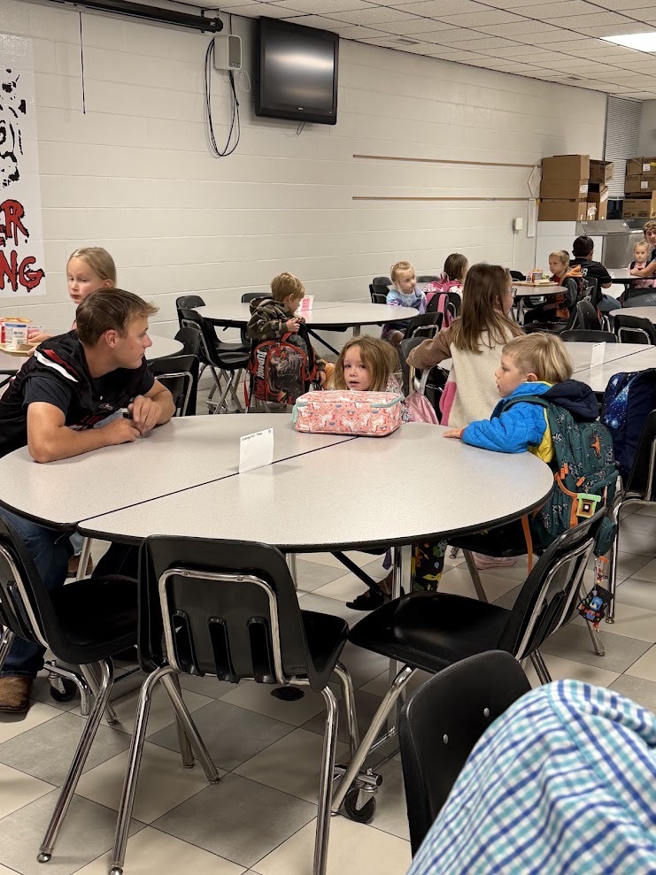 football boys visiting with students