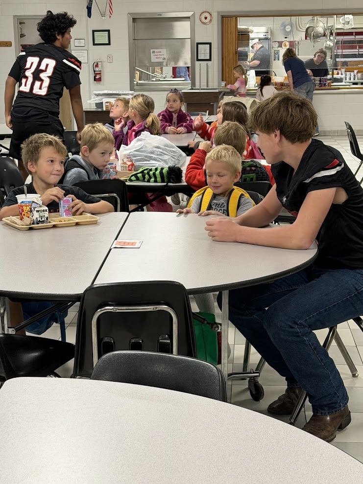 football boys visiting with students