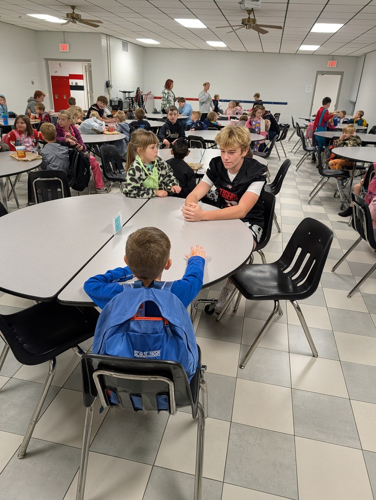 football boys visiting with students