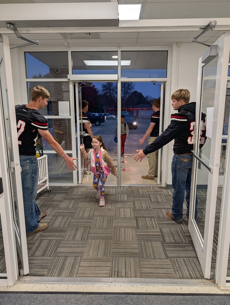 football boys greeting students