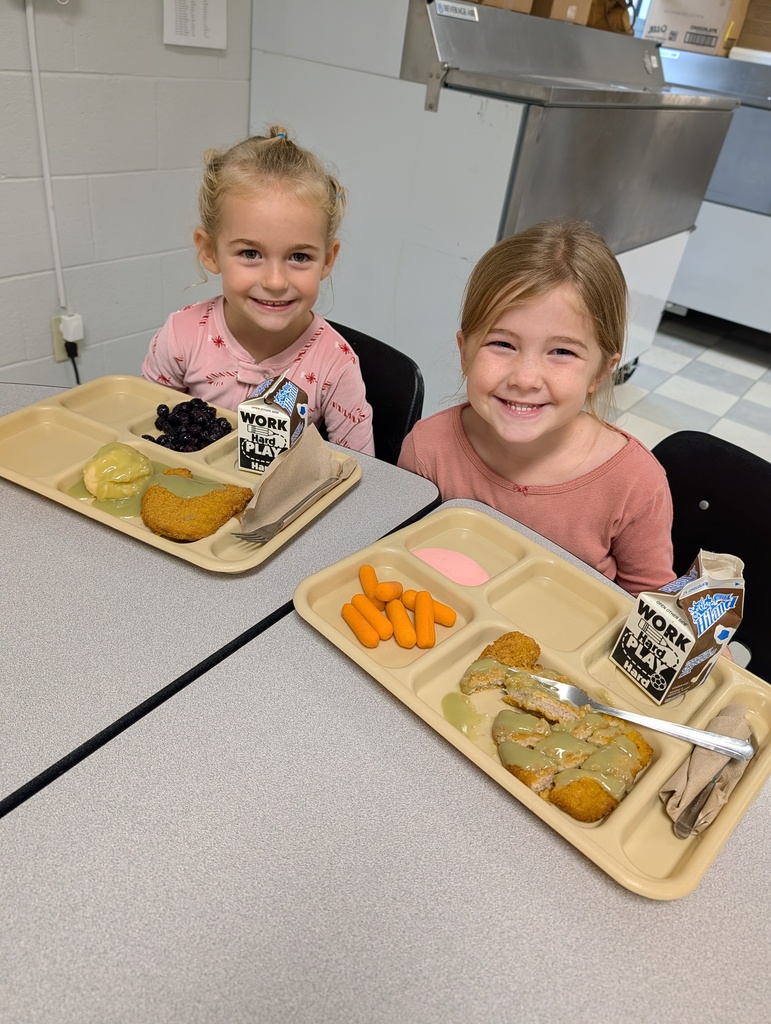 two students with lunch trays
