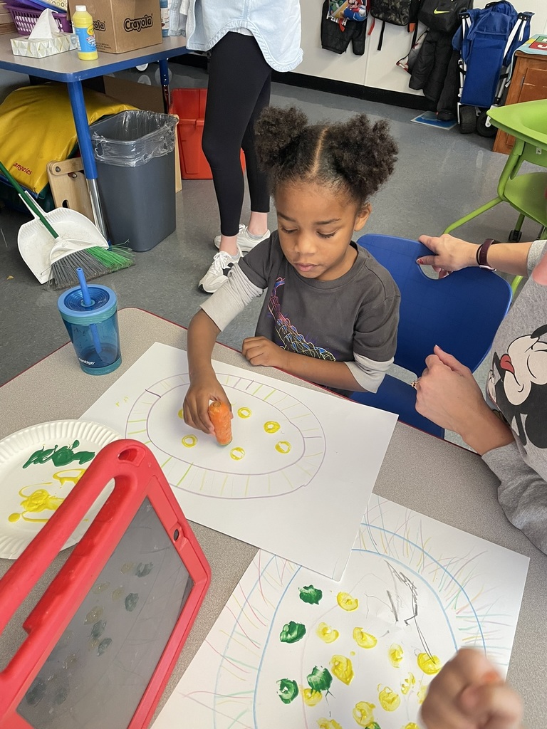 girl paints with carrot