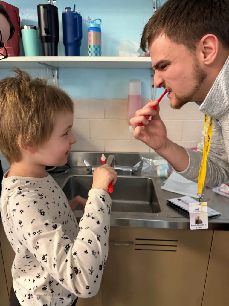 child brushing teeth
