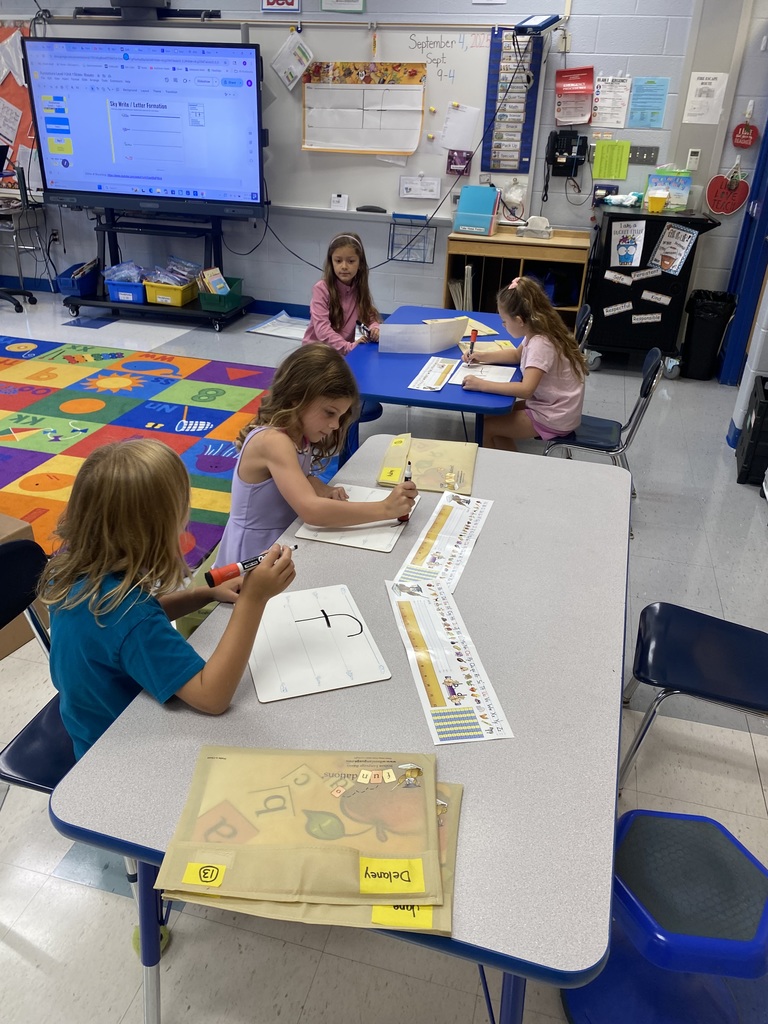 First-grade students in Mrs. Rosato's class used Fundations boards to practice letter formation and handwriting. 