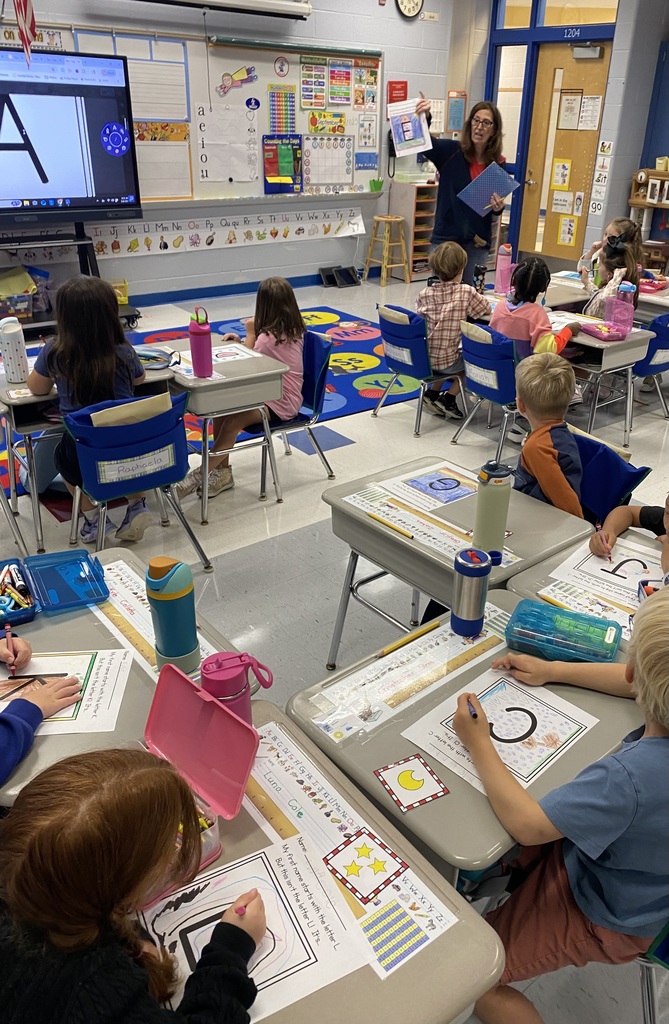 Mrs. Burrows showed an example of the letter decorating project. 
