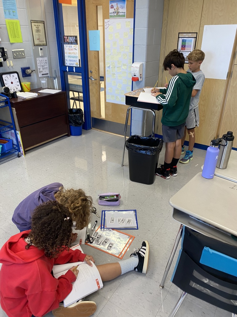 5th graders working around their math classroom.  