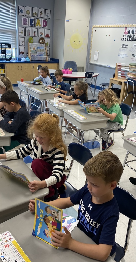 First-graders quietly reading. 