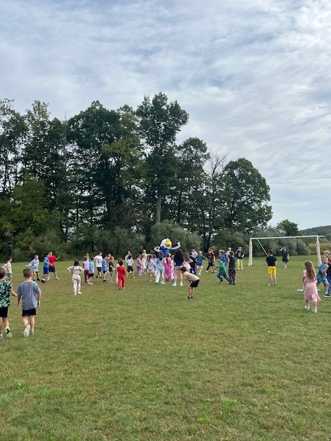Nellie enjoyed some time with the kids on the soccer field. 