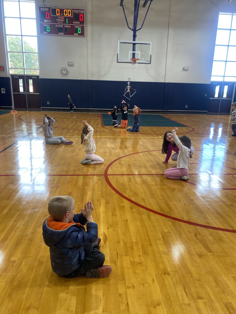 Kindergarteners played a game where they had to pretend to be pumpkins when they got tagged.