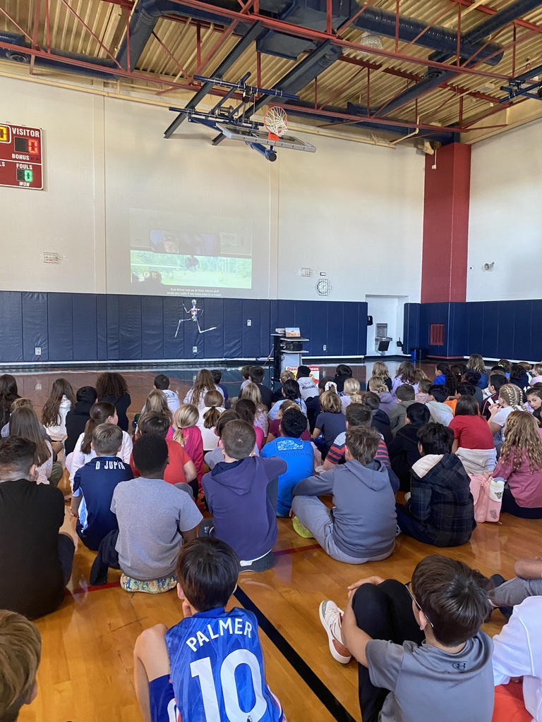 Another group of kids at a bus safety assembly.