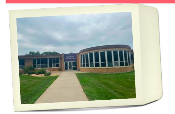 Picture of front entrance of McKinley Early Childhood Center building on top of an envelope graphic